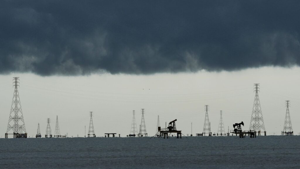 Clouds-form-over-pumpjacks-and-power-transmission-towers-on-Lake-Maracaibo-in-Cabimas-Venezuela-Tues.jpeg